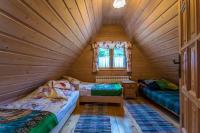 Posteľ alebo postele v izbe v ubytovaní Domki Bacówka Pod Skocznią