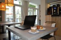 Televízia a/alebo spoločenská miestnosť v ubytovaní Hotel Riva e Mare