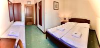 Postel nebo postele na pokoji v ubytování Hotel Buchlovice