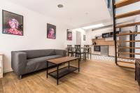 a living room with a couch and a table at STAR WARS in Tourcoing