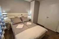Posteľ alebo postele v izbe v ubytovaní Kadarka apartman - Szekszárd