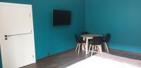 Televízia a/alebo spoločenská miestnosť v ubytovaní Lux Apartament Sienkiewicza