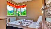 Posteľ alebo postele v izbe v ubytovaní Apartamenty Cicha by Royal Aparts