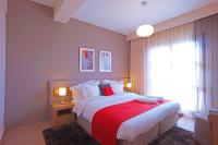 A bed or beds in a room at Pilion Terra Hotel