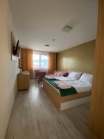Łóżko lub łóżka w pokoju w obiekcie Bešeňová Apartmán Diamant