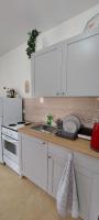 Kuchyň nebo kuchyňský kout v ubytování Apartmani Dejan