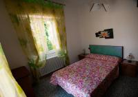 Łóżko lub łóżka w pokoju w obiekcie Casa Vacanza da Tonino
