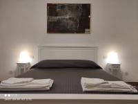 A bed or beds in a room at Villa Punta Piccola sul mare