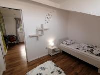 Posteľ alebo postele v izbe v ubytovaní Apartmani Kiko