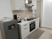 A kitchen or kitchenette at B&B Oplonti Resort