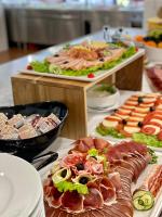 a buffet with different types of food on a table at Family Resort Urania in Baška Voda