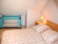 a small bedroom with a bed and a lamp at Gîte Montrésor, 4 pièces, 7 personnes - FR-1-381-72 in Montrésor