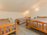 a bedroom with two beds in a room at Gîte La Plaine-sur-Mer, 2 pièces, 4 personnes - FR-1-306-1062 in La Plaine-sur-Mer