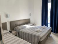 Posteľ alebo postele v izbe v ubytovaní Hotel Arena