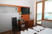 A television and/or entertainment centre at Petrov Family Hotel