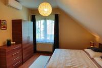 Łóżko lub łóżka w pokoju w obiekcie Apartman Fűzfa