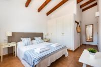A bed or beds in a room at Casa Bruna - Binibeca Nou