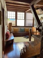 a living room with a couch and a table at Pousada Arte Urquijo in Paraty