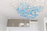a blue and white sculpture of birds on a wall at Appartement neuf vue Marina étang Z&#39;abricot FDF in Fort-de-France