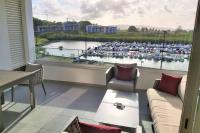 a large living room with a view of a marina at Appartement neuf vue Marina étang Z&#39;abricot FDF in Fort-de-France