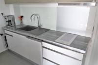 a kitchen with a sink and a laptop on a counter at Appartement neuf vue Marina étang Z&#39;abricot FDF in Fort-de-France