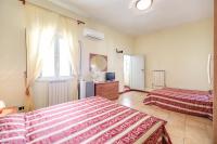 Posteľ alebo postele v izbe v ubytovaní Buonarroti Home