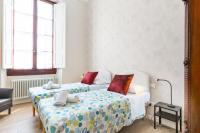 Posteľ alebo postele v izbe v ubytovaní I Renai - Ponte delle Grazie Modern Apartment