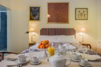 A bed or beds in a room at Palazzo Bernardini Suites