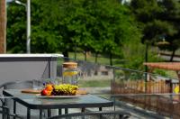 A garden outside Aelia Seaside Luxury Suites