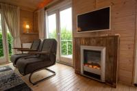 TV a/nebo společenská místnost v ubytování chalet Esra 190
