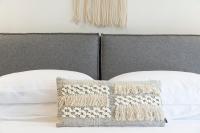 A bed or beds in a room at Aelia Seaside Luxury Suites