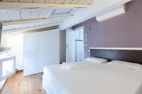 A bed or beds in a room at Asinelli, Bologna by Short Holidays