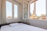A bed or beds in a room at Asinelli, Bologna by Short Holidays