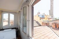 A bed or beds in a room at Asinelli, Bologna by Short Holidays