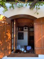 a room with a bed inside of a house at Pousada Arte Urquijo in Paraty