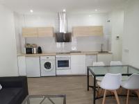 Kuchyň nebo kuchyňský kout v ubytování Apartamentos Balcón de la Vega