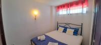 A bed or beds in a room at Apartment Sea View in Rincon de Loix- free parking, pool, Wi-Fi, new air conditioning