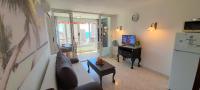 A television and/or entertainment centre at Apartment Sea View in Rincon de Loix- free parking, pool, Wi-Fi, new air conditioning
