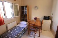 A television and/or entertainment centre at COZY APARTMENT IN THE HEART OF THE TOWN