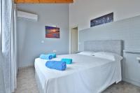 A bed or beds in a room at Fotini Studios