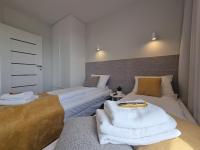 Posteľ alebo postele v izbe v ubytovaní Apartament Południowy Gąski - 365PAM