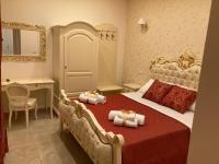 A bed or beds in a room at B&B Orchidea