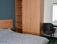 Łóżko lub łóżka w pokoju w obiekcie Yako Apartment - Wagrain Center
