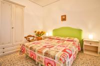 A bed or beds in a room at Apartment with 4 bedrooms in Amalfi
