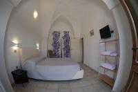 Postel nebo postele na pokoji v ubytování Masseria Lama D'impisa