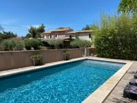 a swimming pool in the backyard of a house at Mas Guiraud, un instant rêvé in Beaucaire