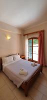 Posteľ alebo postele v izbe v ubytovaní Paleo Inn Hotel