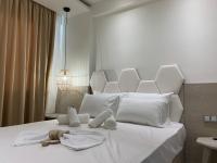 Posteľ alebo postele v izbe v ubytovaní Amalia Deluxe Villas