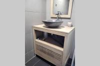 a bathroom with a sink and a mirror at le studio du fou in Mortagne-sur-Sèvre