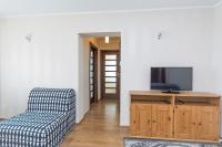 Televízia a/alebo spoločenská miestnosť v ubytovaní Apartament Nadmorski Wyspa Sobieszewska